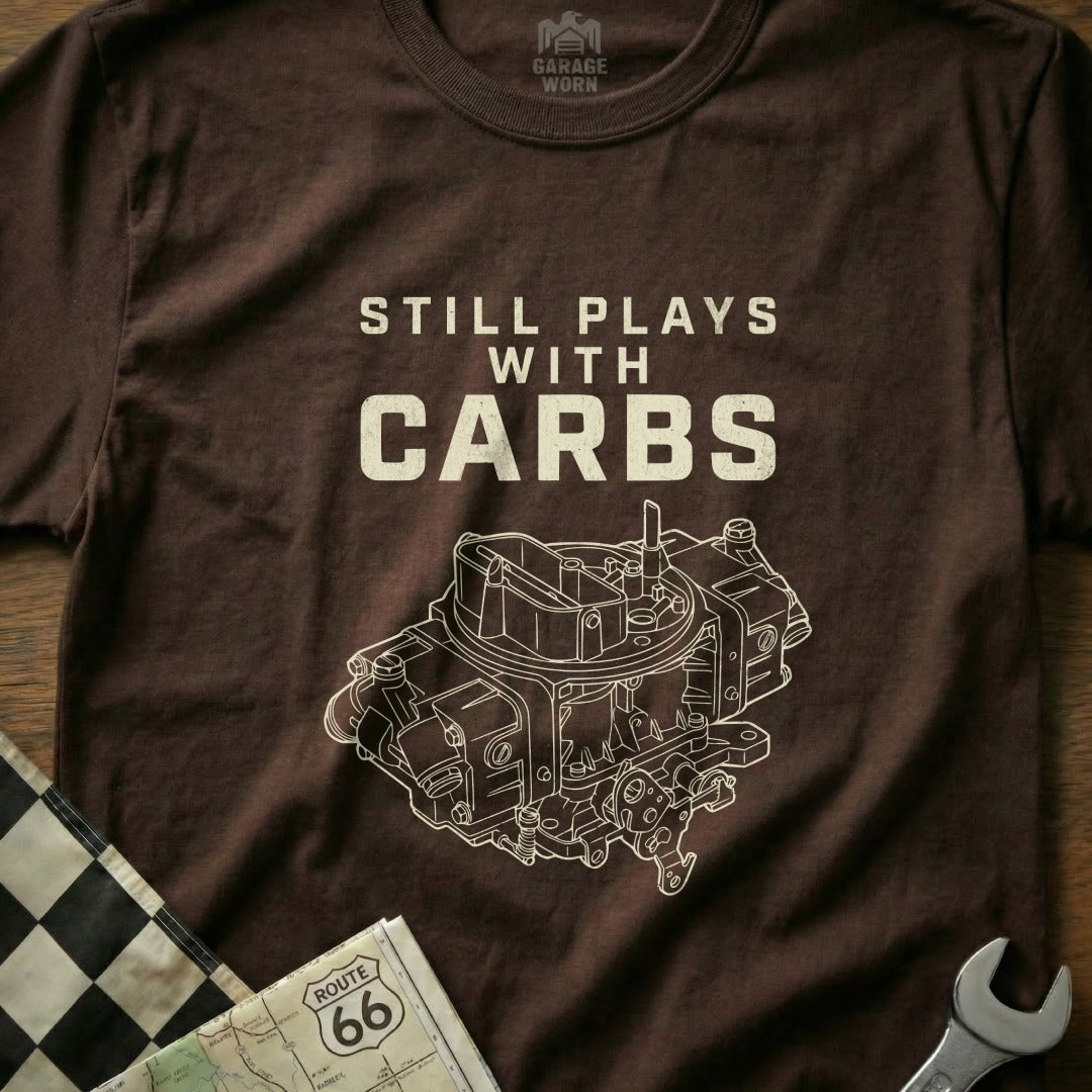 Brown t-shirt with "Still Plays With Carbs" and a detailed carburetor illustration.