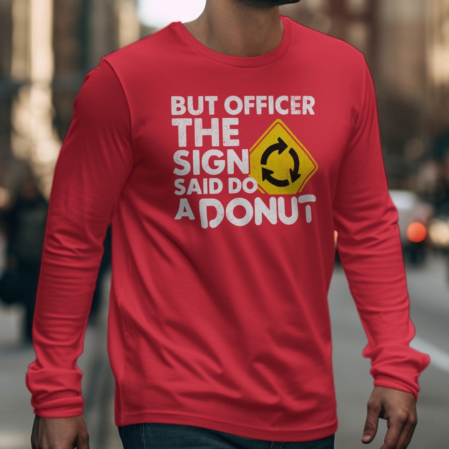 Red long-sleeve shirt with text and roundabout sign graphic.