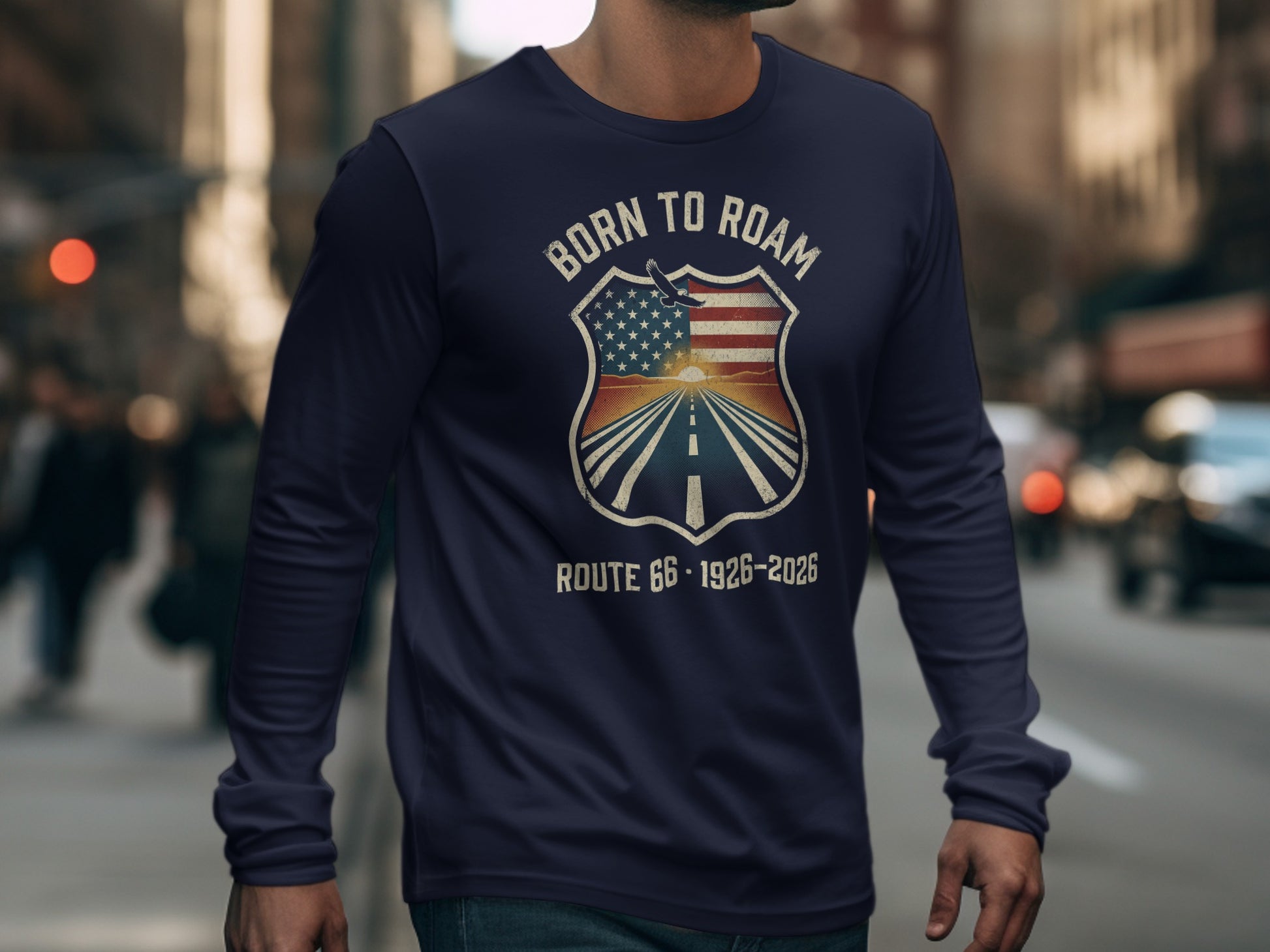 Long sleeve shirt with "Born to Roam" shield graphic featuring road and US flag.