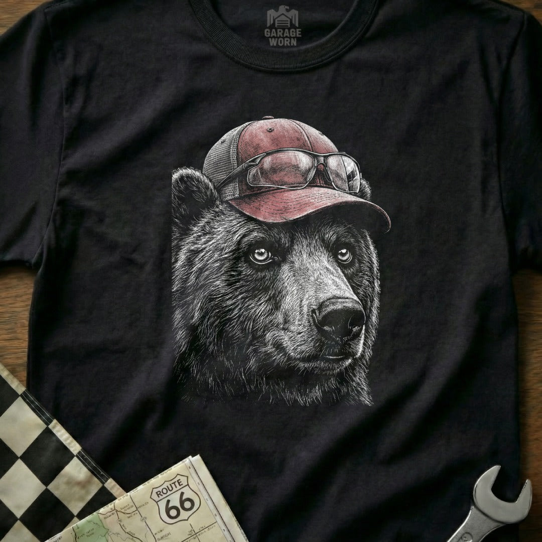 Black t-shirt with a sketch of a bear wearing a baseball cap and sunglasses.