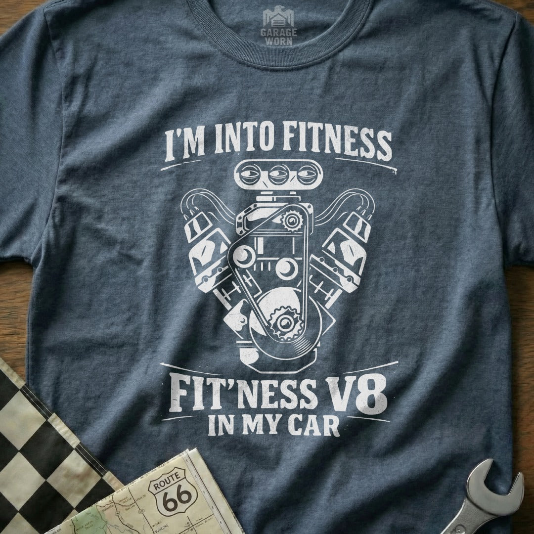 Graphic t-shirt with "I'm Into Fitness Fit'ness V8 In My Car" text and engine illustration.