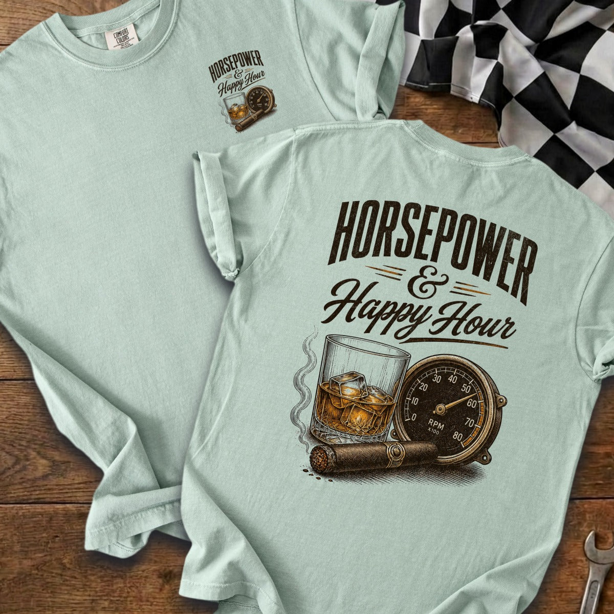 Light blue tee shirt with front pocket print and back graphic of whiskey and cigar.