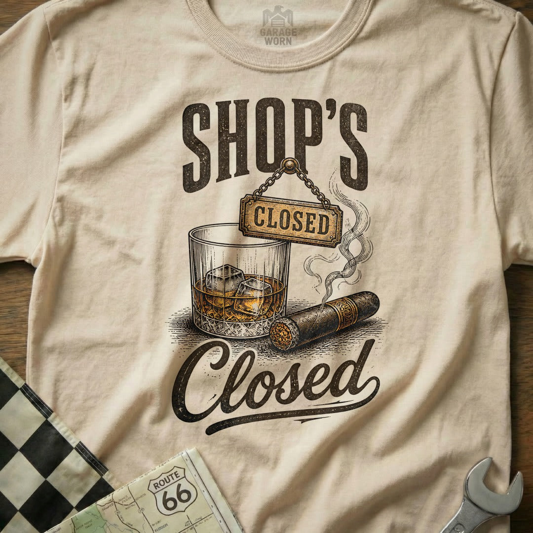 T-shirt graphic with "Shop's Closed" over whiskey, cigar, and Route 66 map.