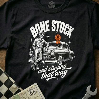 Skeleton leans on a classic car with text "Bone Stock and staying that way".