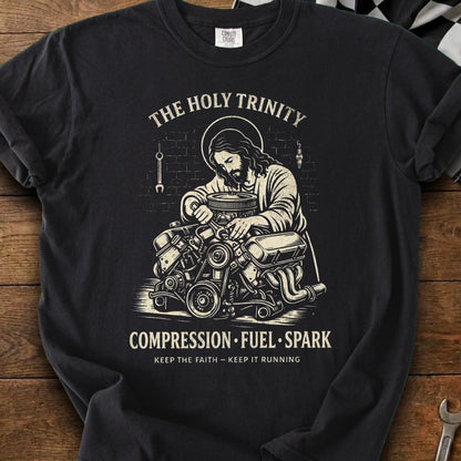 Jesus working on an engine with text "The Holy Trinity, Compression, Fuel, Spark."