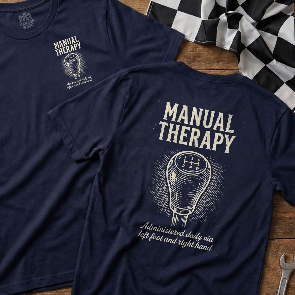 Navy t-shirt with "Manual Therapy" and gear shift graphic.