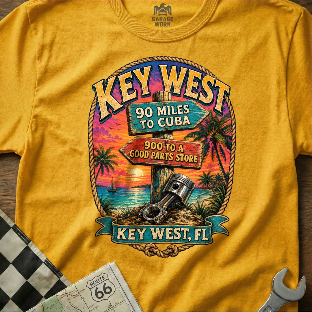Yellow t-shirt features "Key West, FL" graphic with directional signs and piston.