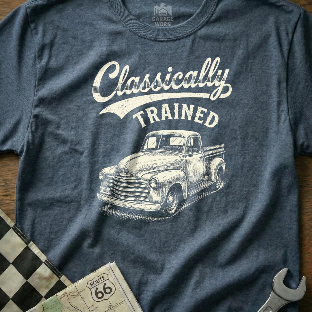 "Classically Trained" text with a vintage truck graphic on a blue heather t-shirt.