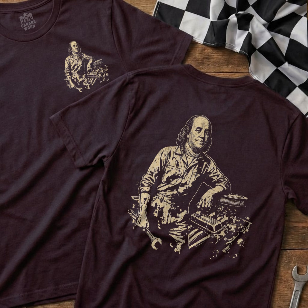Benjamin Franklin depicted as a mechanic with engine and tools on t-shirt.