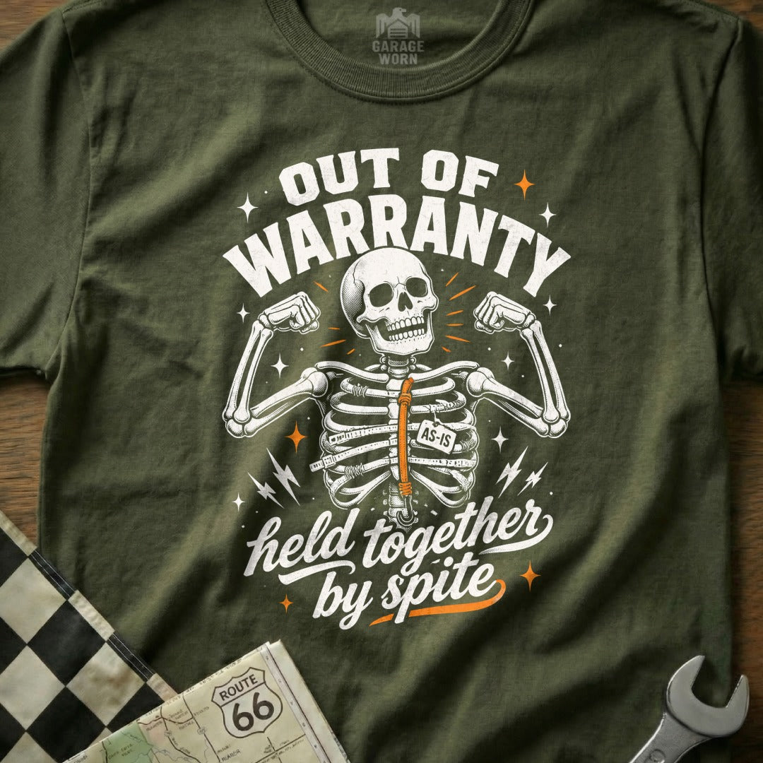 Olive t-shirt with skeleton graphic: "Out of Warranty, Held Together by Spite"