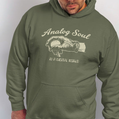 Green hoodie with "Analog Soul in a Digital World" text and baseball glove graphic.