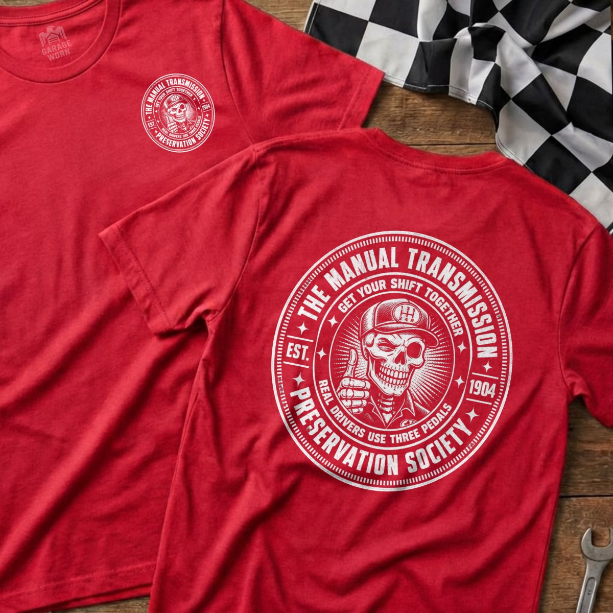 Red t-shirt with "Manual Transmission Preservation Society" graphic and skull logo.