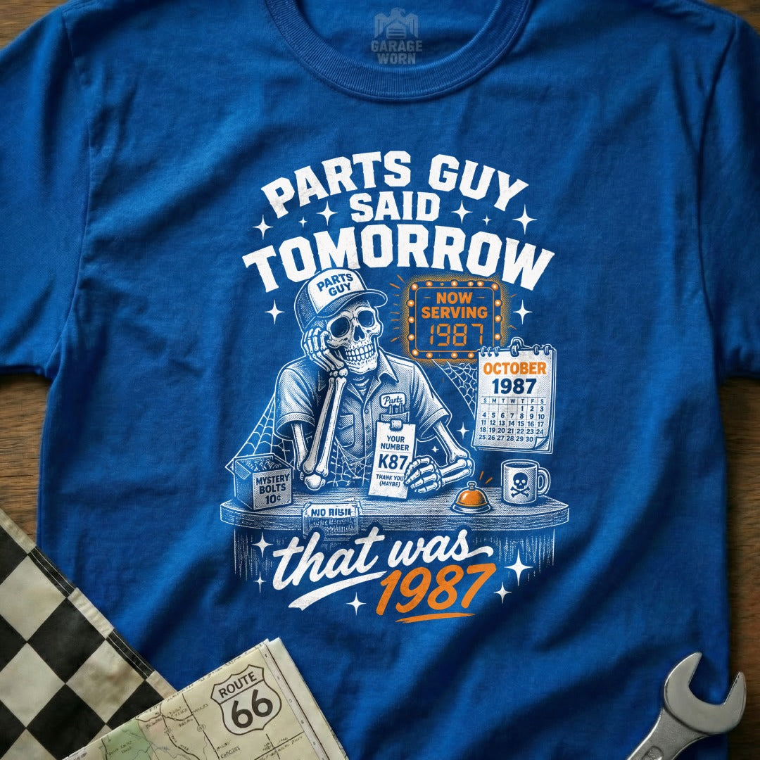 Skeleton in mechanic's uniform with "Parts Guy Said Tomorrow" and "That Was 1987" text.