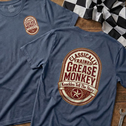 Blue t-shirt with "Classically Trained Grease Monkey" logo on back.