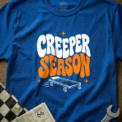 Blue t-shirt with "CREEPER SEASON" text and a rolling creeper graphic.