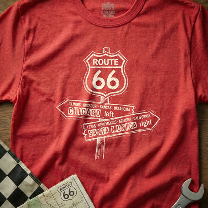 Route 66 directional sign graphic on a red t-shirt.