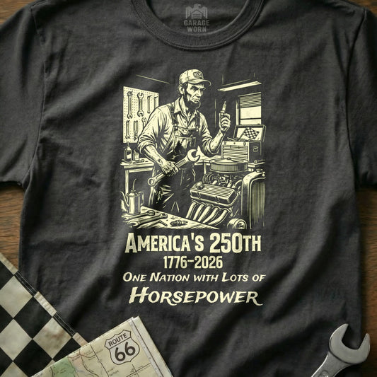 Black t-shirt with "America's 250th 1776-2026 One Nation With Lots of Horsepower" text and mechanic graphic.