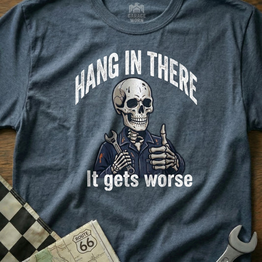 Skeleton wearing a wrench and giving a thumbs up on a t-shirt with text.
