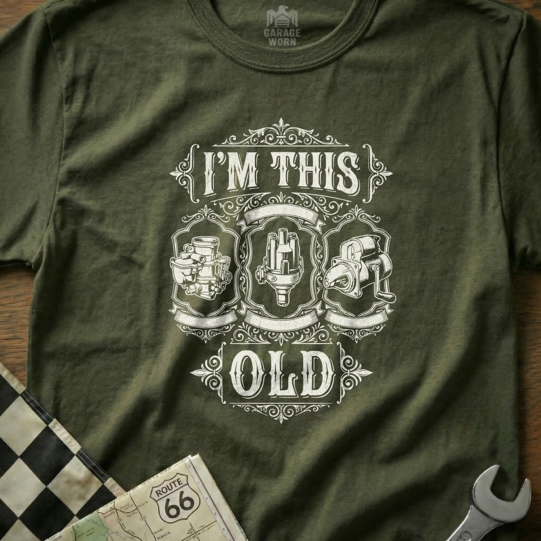 Green t-shirt with "I'm This Old" and car part graphics.