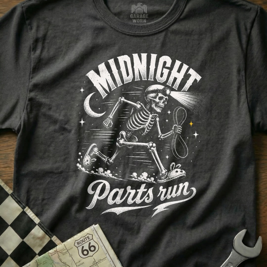 Dark t-shirt with "Midnight Parts Run" text and a skeleton running with a headlamp.