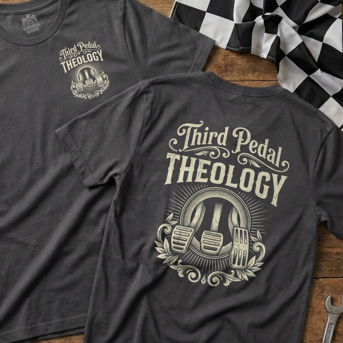 Dark gray t-shirt with "Third Pedal Theology" and clutch, brake, and gas pedals logo.