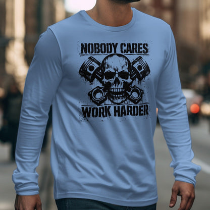 Light blue long sleeve shirt with skull, pistons, and text: Nobody Cares Work Harder.