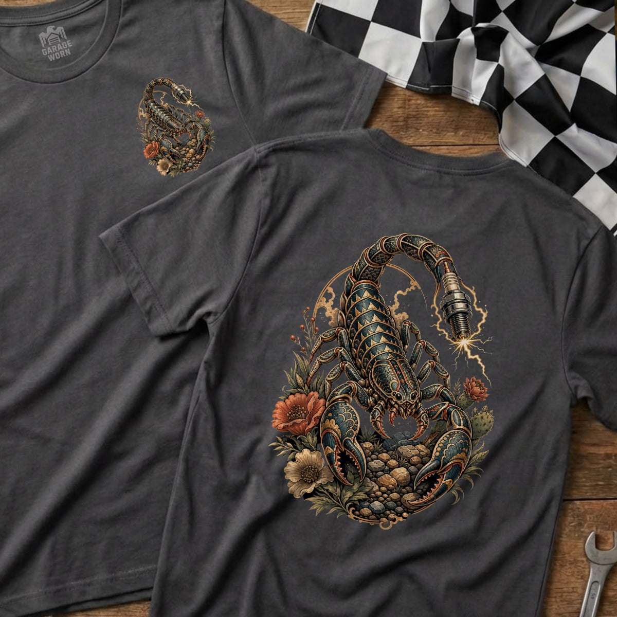 Dark grey t-shirts featuring a detailed scorpion illustration with a spark plug and flowers.