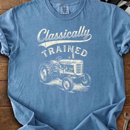 Blue t-shirt with "Classically TRAINED" text and an illustration of a vintage tractor.