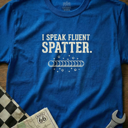 Blue t-shirt with "I SPEAK FLUENT SPATTER." text and bubbles design.