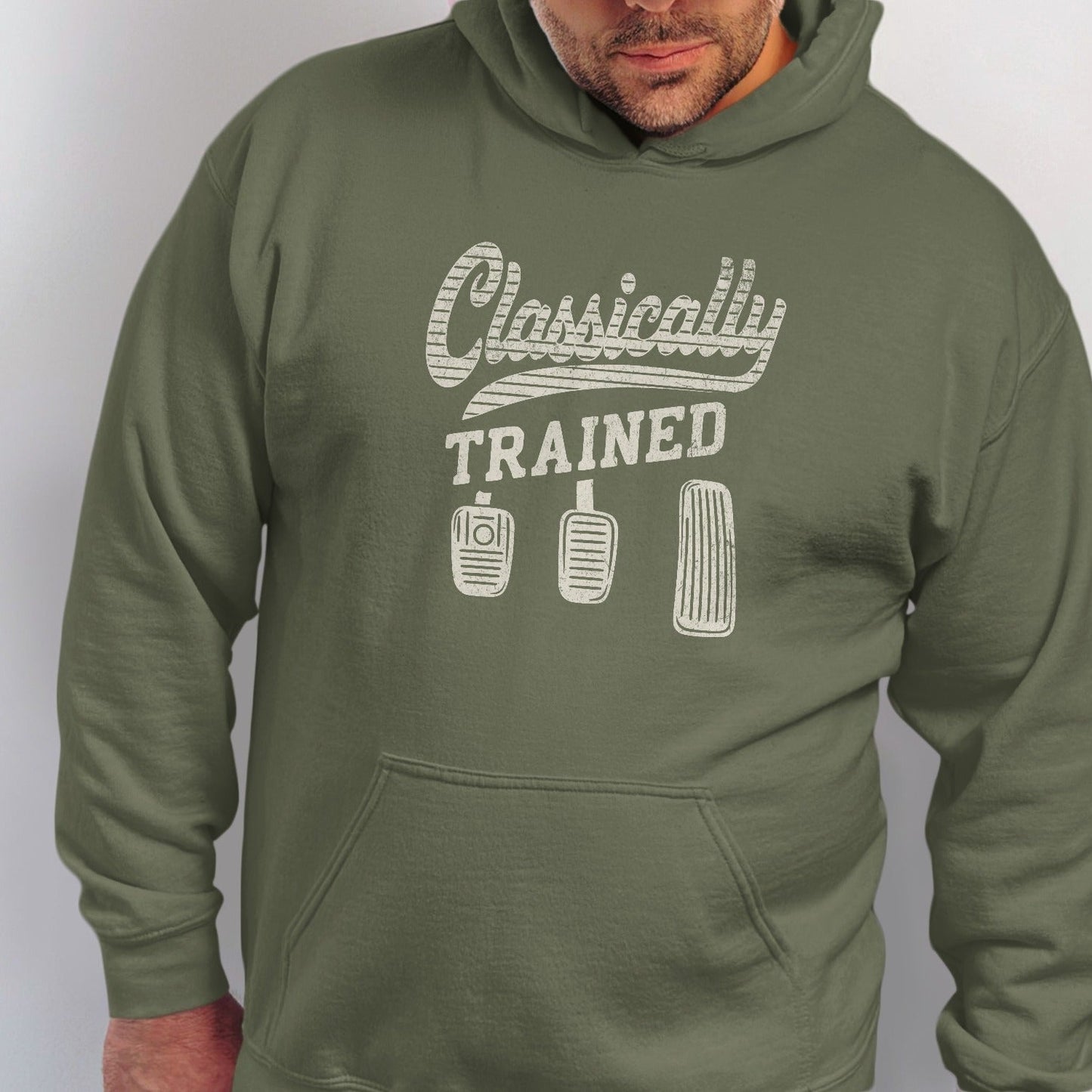 Olive green hoodie with "Classically TRAINED" and three car pedals graphic.
