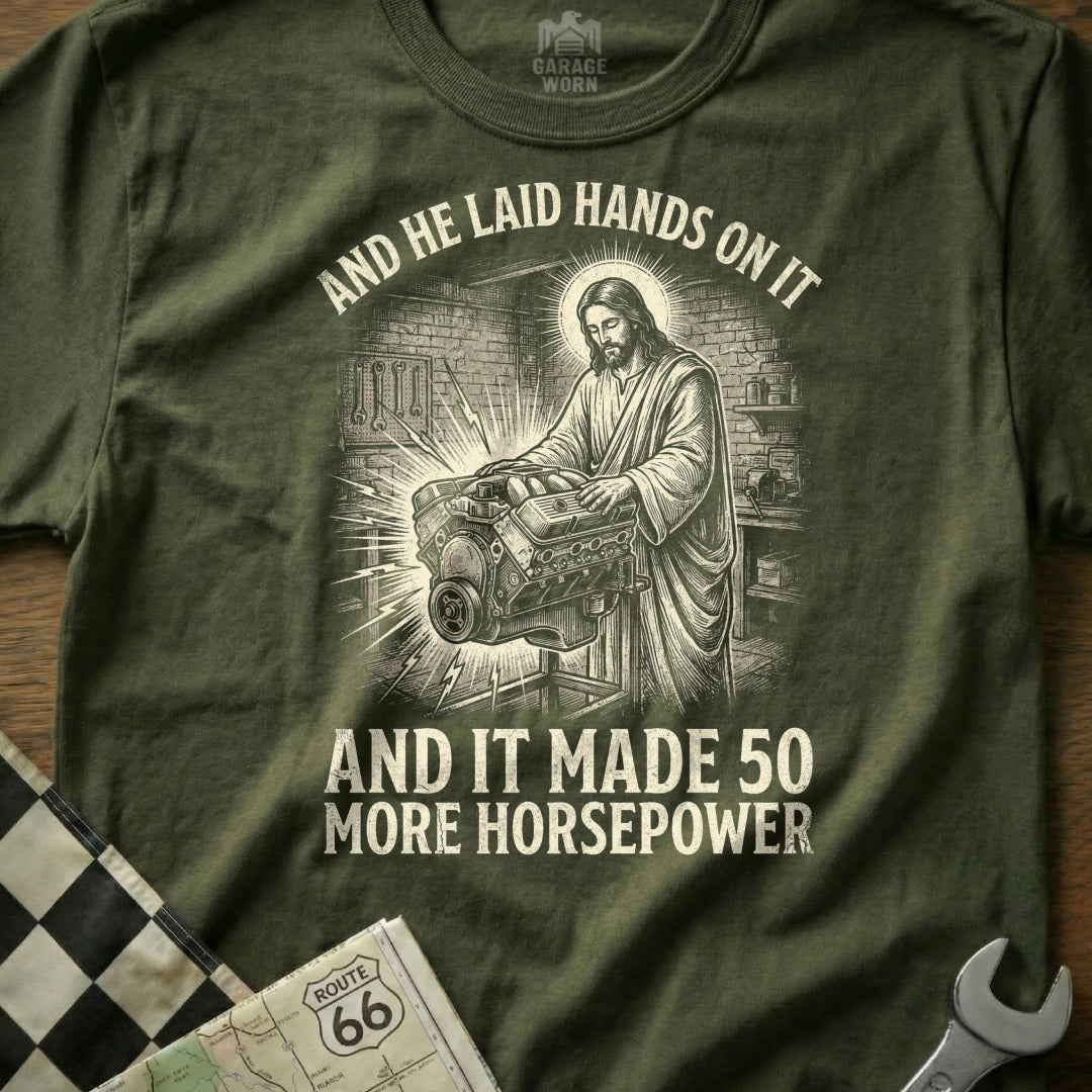 Jesus working on an engine, with text "And he laid hands on it and it made 50 more horsepower".