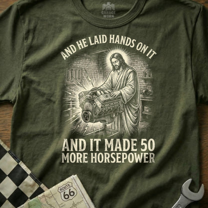 Jesus working on an engine, with text "And he laid hands on it and it made 50 more horsepower".