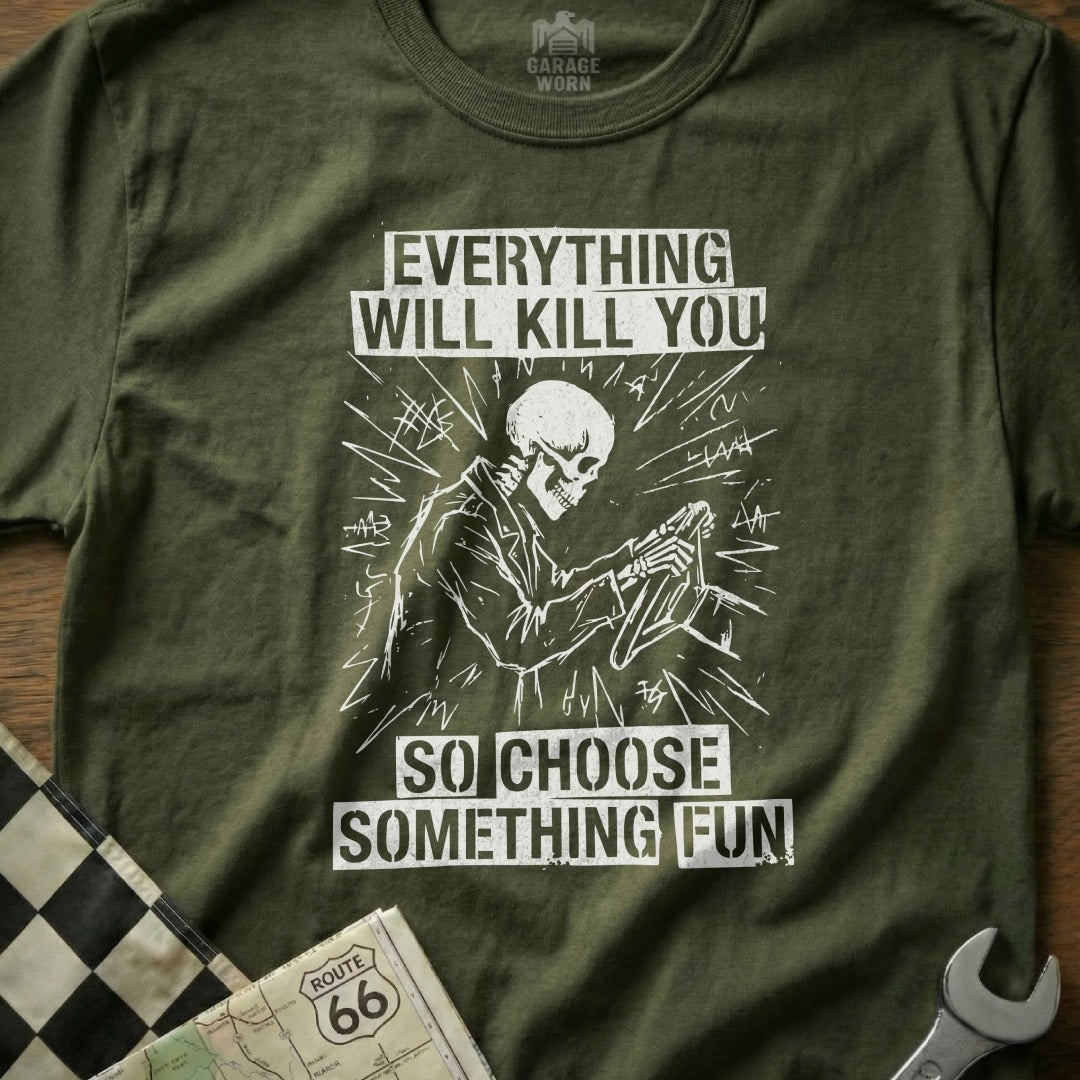 Olive green t-shirt with skeleton driving a car and text "Everything will kill you so choose something fun".