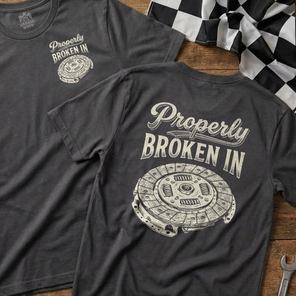 T-shirt with "Properly Broken In" text and clutch plate illustration.