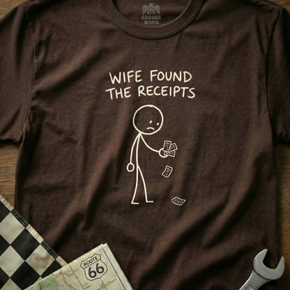 Brown t-shirt with stick figure holding receipts and text "Wife found the receipts".