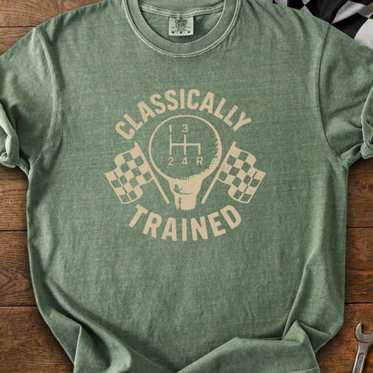 T-shirt with "Classically Trained" text, manual shift knob, and checkered flags.