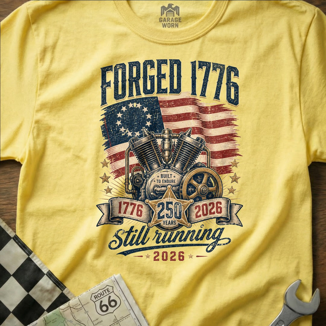 Yellow t-shirt with "FORGED 1776" and motorcycle engine graphic.