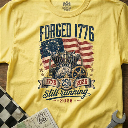 Yellow t-shirt with "FORGED 1776" and motorcycle engine graphic.