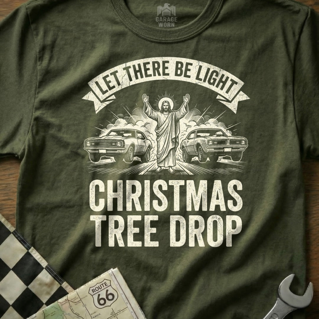 Jesus with arms raised between two muscle cars, "LET THERE BE LIGHT CHRISTMAS TREE DROP".