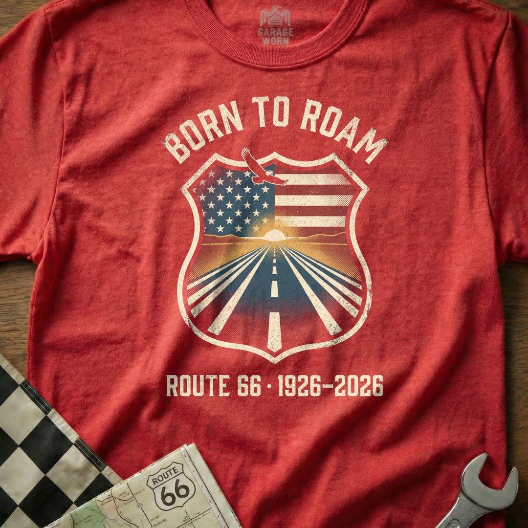 Red t-shirt with "Born to Roam Route 66 1926-2026" text and shield graphic.