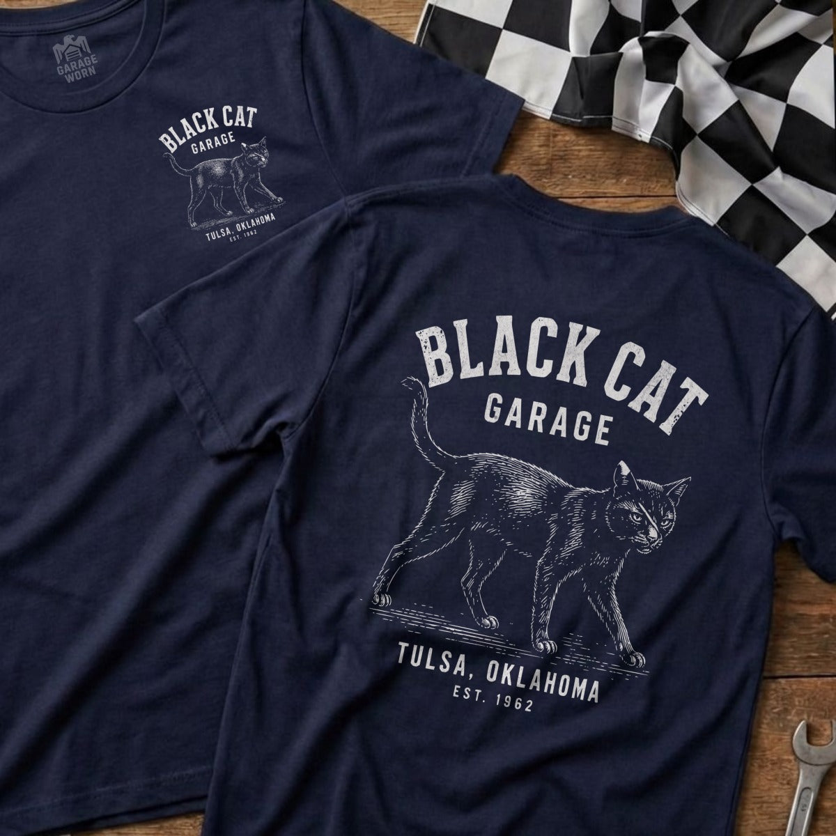Navy t-shirt with black cat and "Black Cat Garage Tulsa, Oklahoma Est. 1962" graphic.