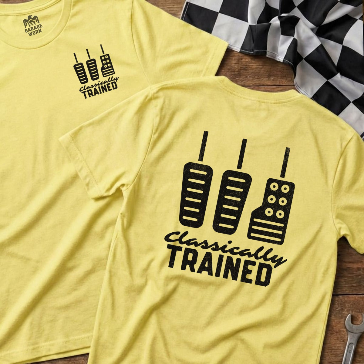Yellow t-shirt with "Classically Trained" and three car pedals graphic.