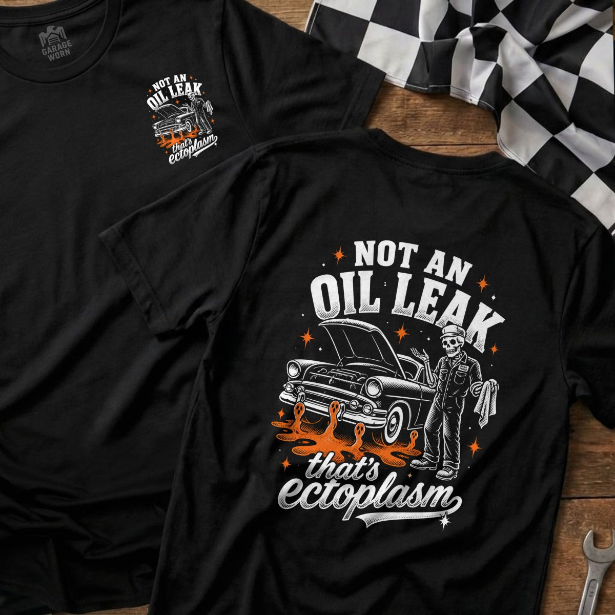 Black t-shirt with "Not an oil leak that's ectoplasm" graphic and skeleton mechanic.
