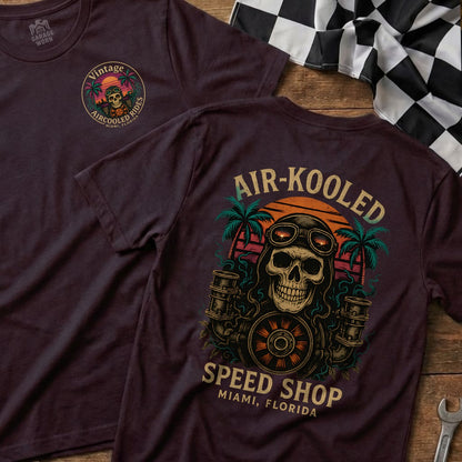 Burgundy t-shirt with skull, goggles, and "Air-Kooled Speed Shop Miami, Florida" text.