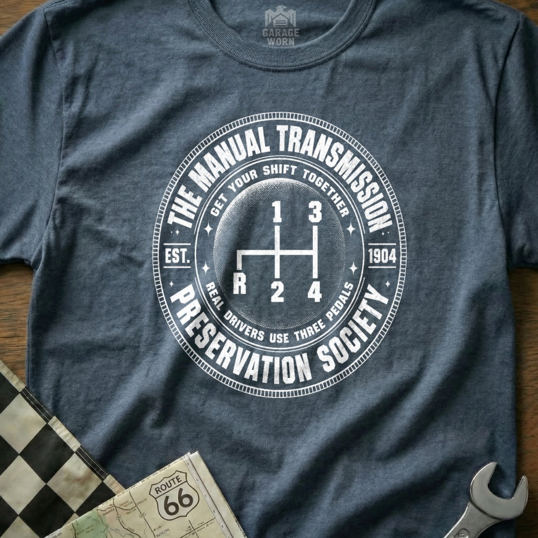 Dark gray t-shirt with "The Manual Transmission Preservation Society" graphic.