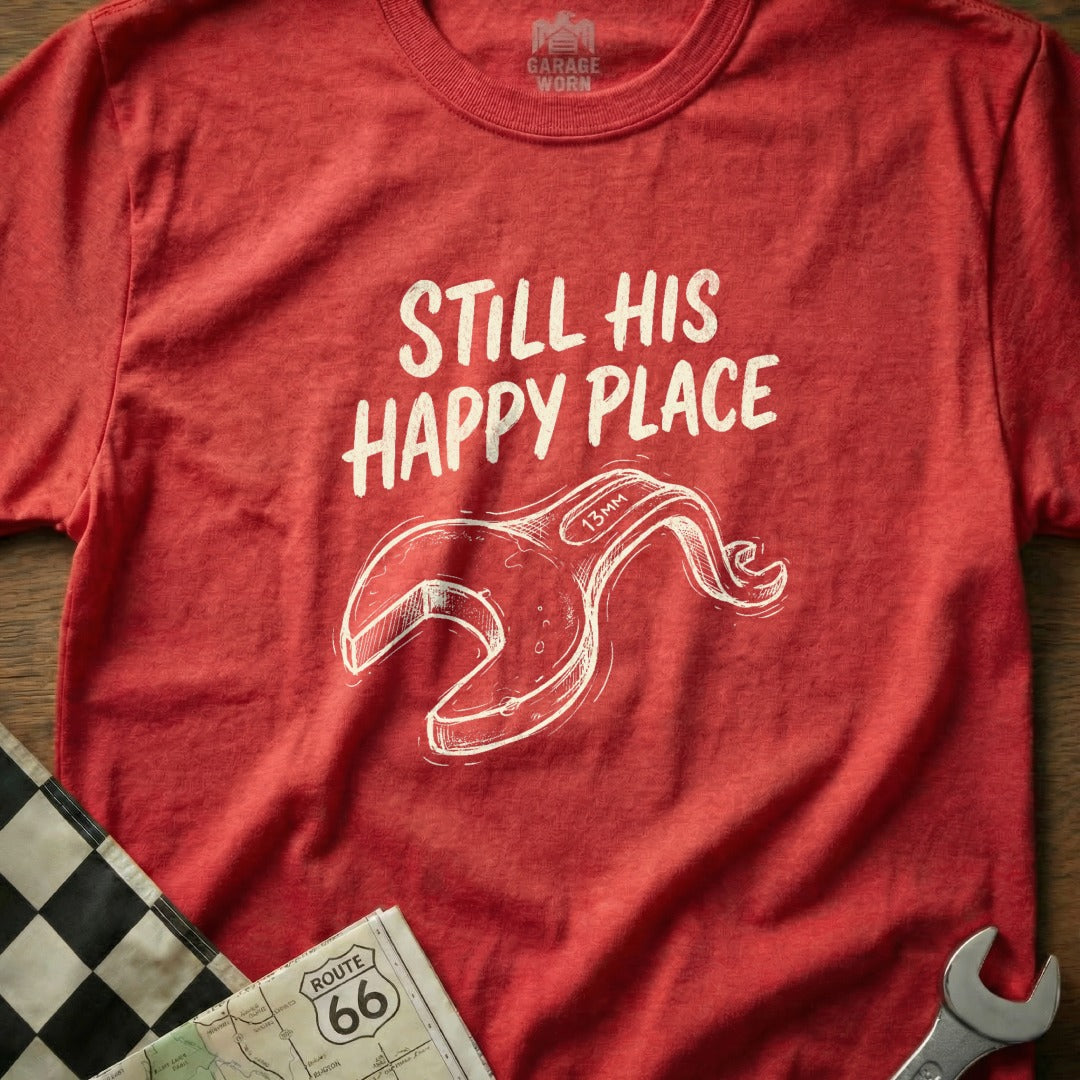 Red t-shirt with "Still His Happy Place" and a wrench graphic.