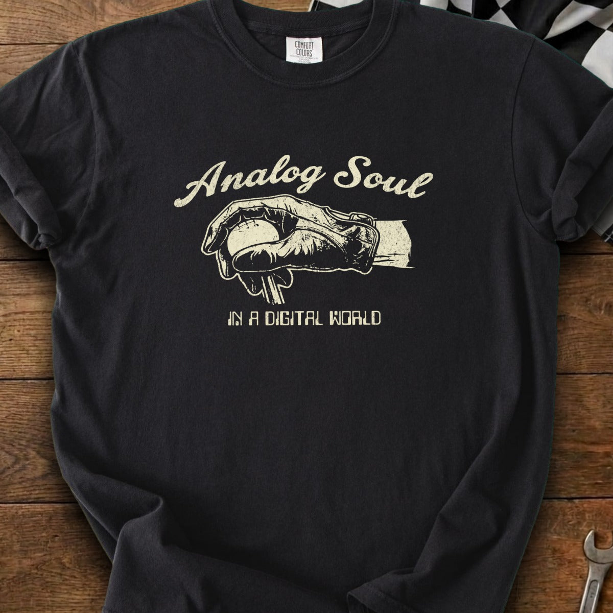 Black t-shirt with "Analog Soul in a Digital World" text and baseball graphic.