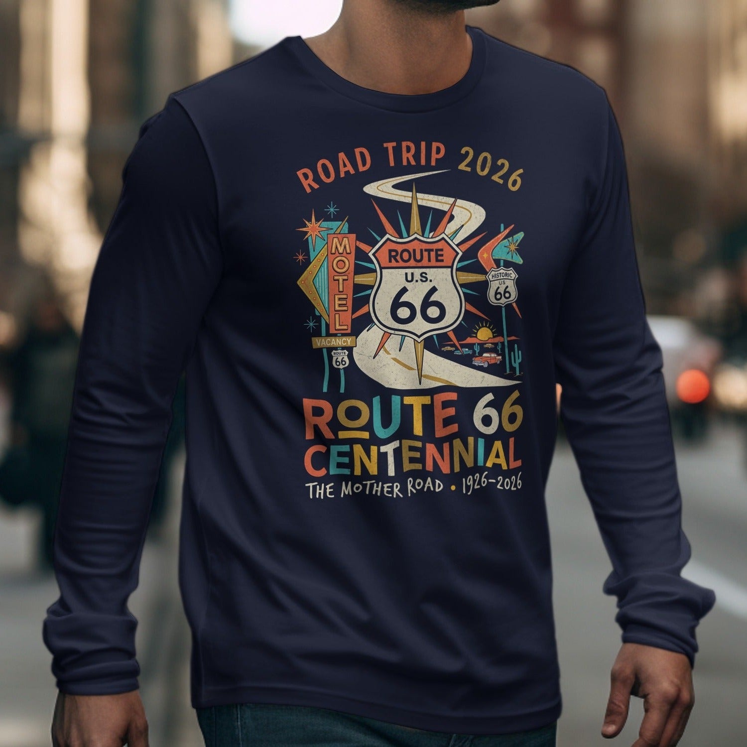 Navy long-sleeve shirt with Route 66 Centennial graphic and "Road Trip 2026" text.