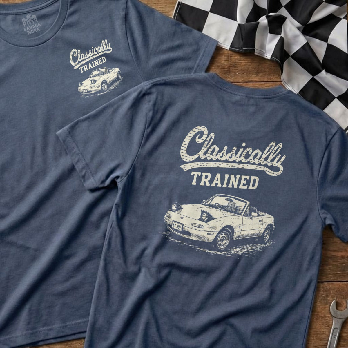 Two navy blue t-shirts with "Classically Trained" and a vintage Mazda Miata graphic.