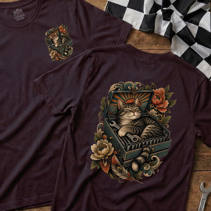 T-shirt with a tabby cat resting in an open toolbox with tools and flowers.
